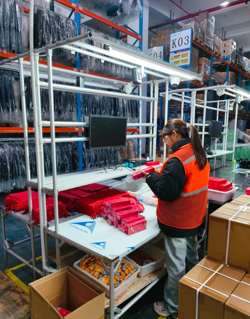 Worker preparing products at a warehouse packing bench